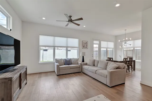 a living room with fireplace furniture and a flat screen tv