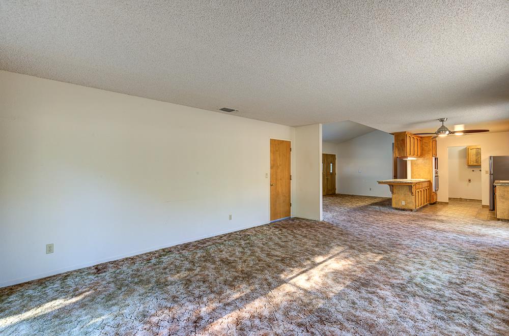 27266 Twin Ponds Road Clovis, CA 93619 - Photo 17 of 45 a view of a big room with closet and wooden floor