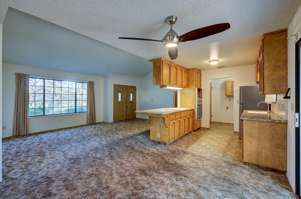 27266 Twin Ponds Road Clovis, CA 93619 - Photo 19 of 45 a large kitchen with a lot of cabinets and wooden floor