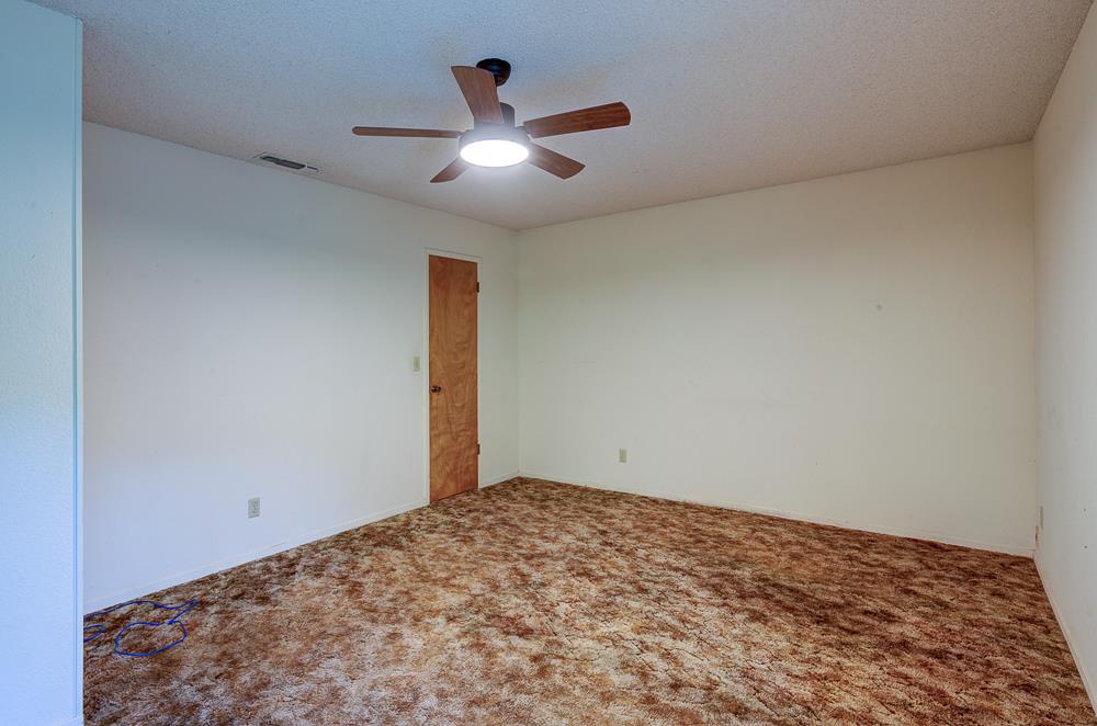 27266 Twin Ponds Road Clovis, CA 93619 - Photo 31 of 45 a view of a big room with wooden floor