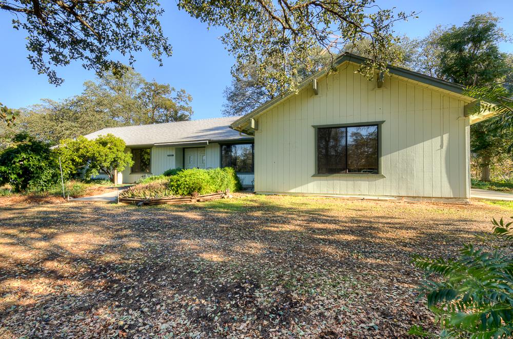 27266 Twin Ponds Road Clovis, CA 93619 - Photo 7 of 45 a front view of house with yard and trees in the background