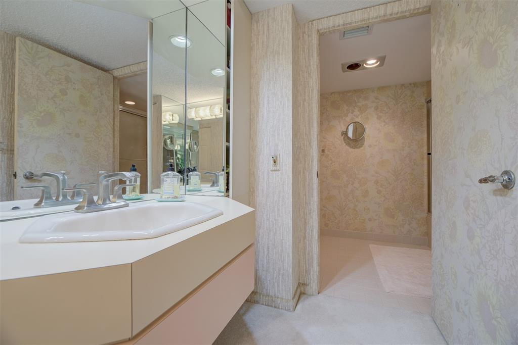 4600 South Ocean Boulevard, Unit 603 Highland Beach, FL 33487 - Photo 14 of 35 a bathroom with a sink and a mirror