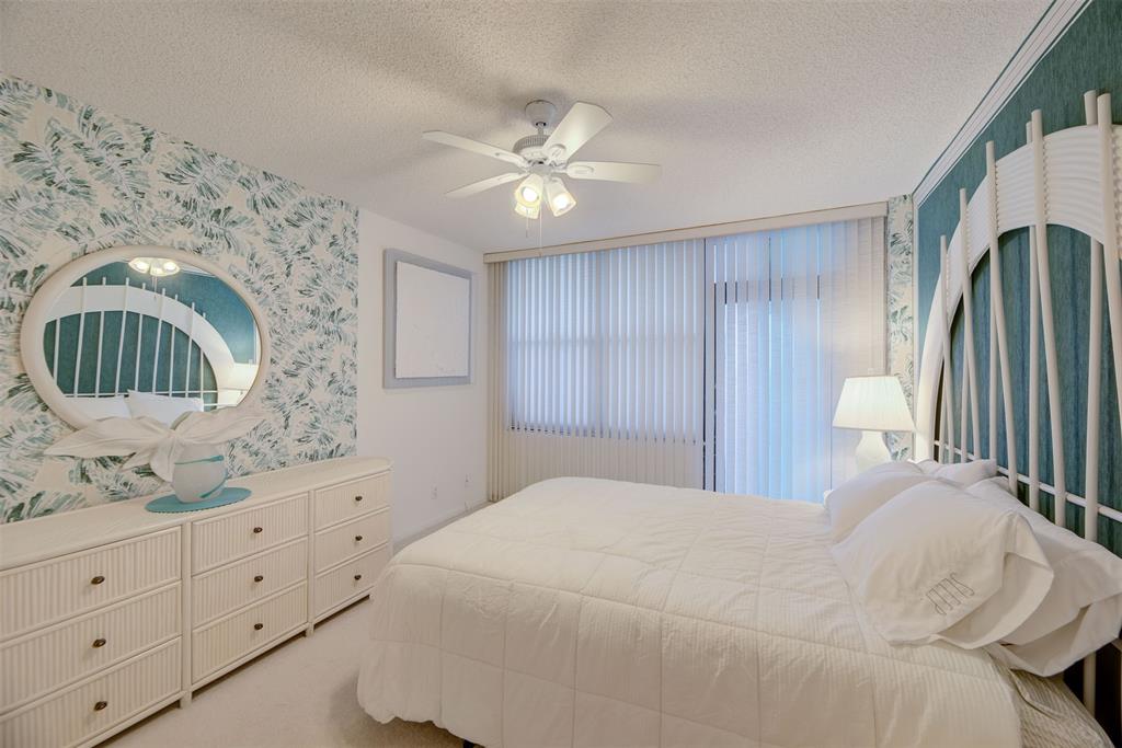 4600 South Ocean Boulevard, Unit 603 Highland Beach, FL 33487 - Photo 17 of 35 a bedroom with a bed and a dresser