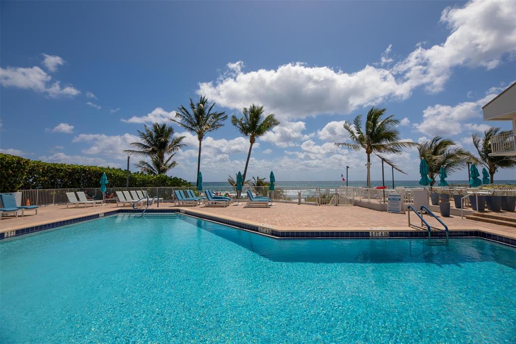4600 South Ocean Boulevard, Unit 603 Highland Beach, FL 33487 - Photo 22 of 35 a view of a swimming pool and lounge chair