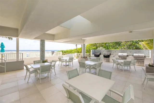 a view of a chairs and table in patio