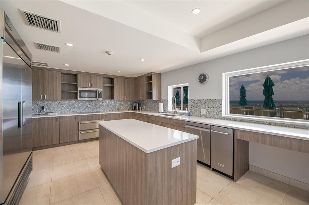 4600 South Ocean Boulevard, Unit 603 Highland Beach, FL 33487 - Photo 28 of 35 a kitchen with a sink counter top space and appliances