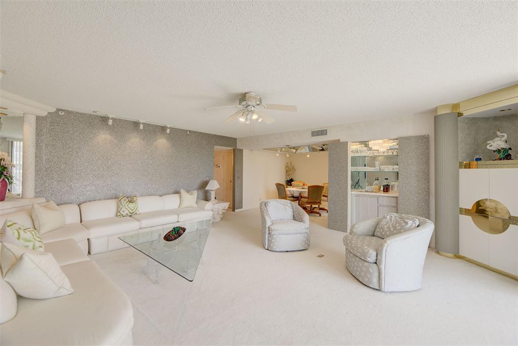 4600 South Ocean Boulevard, Unit 603 Highland Beach, FL 33487 - Photo 6 of 35 a living room with furniture and white walls