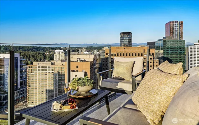 a view of swimming pool with outdoor seating