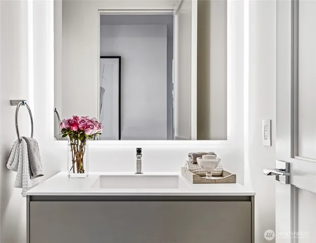 a bathroom with a sink and a mirror