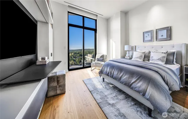 a bedroom with a large bed and a couch