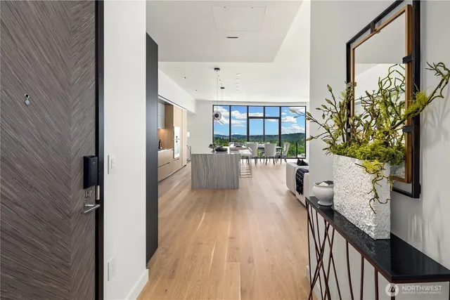 a view of a kitchen with furniture and a potted plant