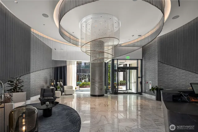 a very nice looking room with a large window and chandelier