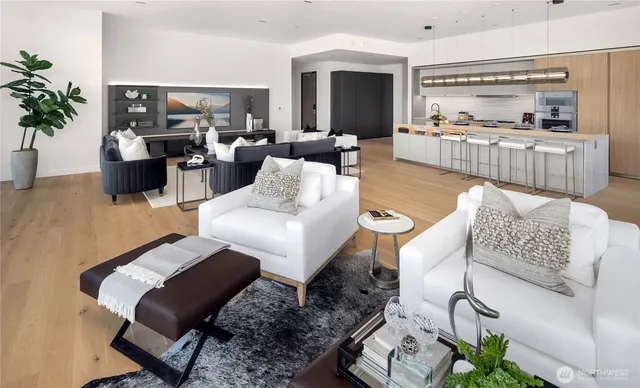 a living room with furniture or couch and a kitchen