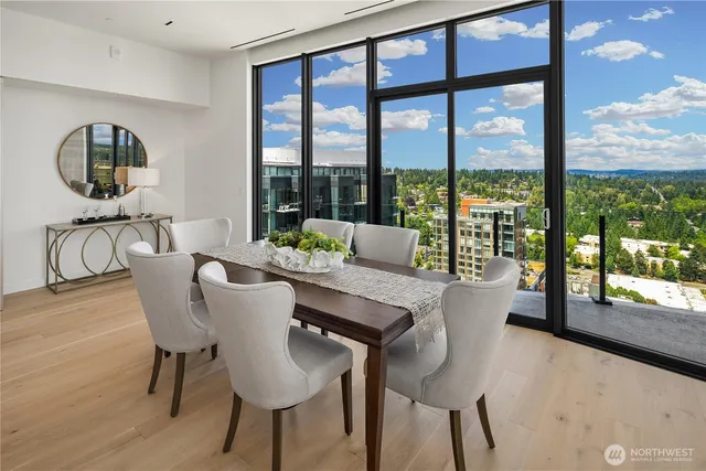 a view of a dining room with furniture window and wooden floor