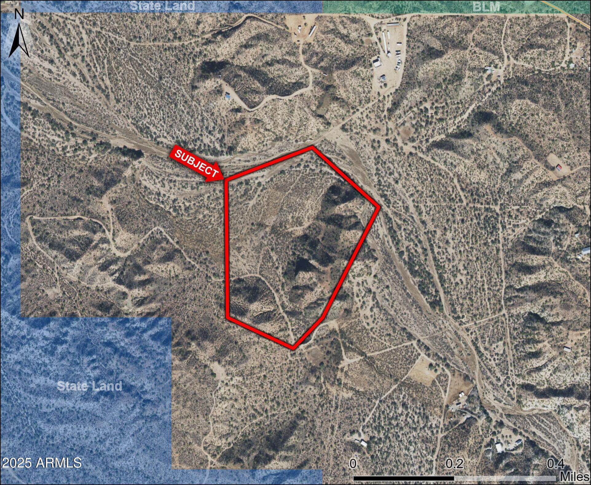 0 North Cozy Cove Road Florence, AZ 85132 - Photo 2 of 4 a street sign on a brick wall