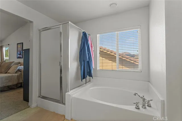 a white bath tub sitting next to a window