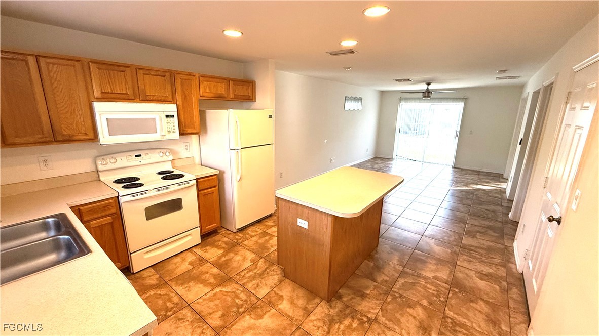 5224 Glenlivet Road Fort Myers, FL 33907 - Photo 2 of 19 a kitchen with stainless steel appliances granite countertop a sink stove and refrigerator