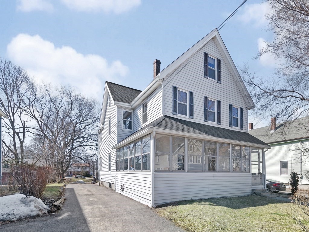 29 Garfield Avenue Boston, MA 02136 - Photo 1 of 27 a front view of a house with a yard covered with snow