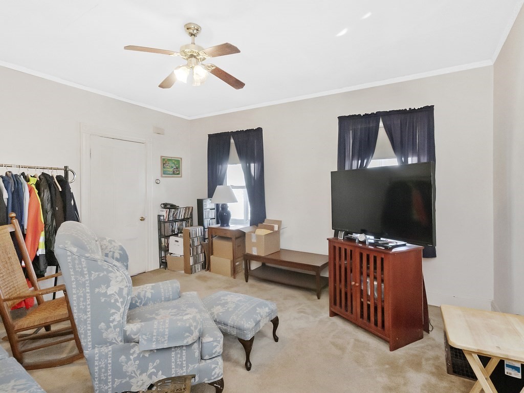 29 Garfield Avenue Boston, MA 02136 - Photo 16 of 27 a living room with furniture and a flat screen tv