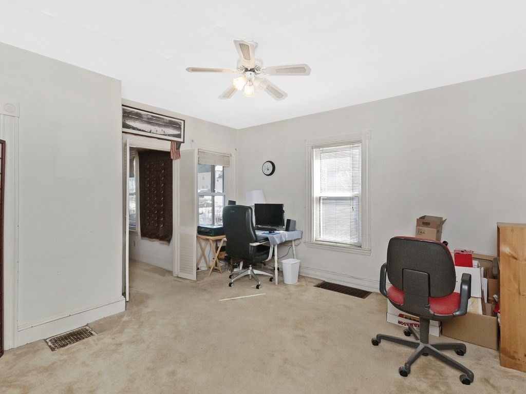 29 Garfield Avenue Boston, MA 02136 - Photo 17 of 27 a view of a workspace with furniture and a window