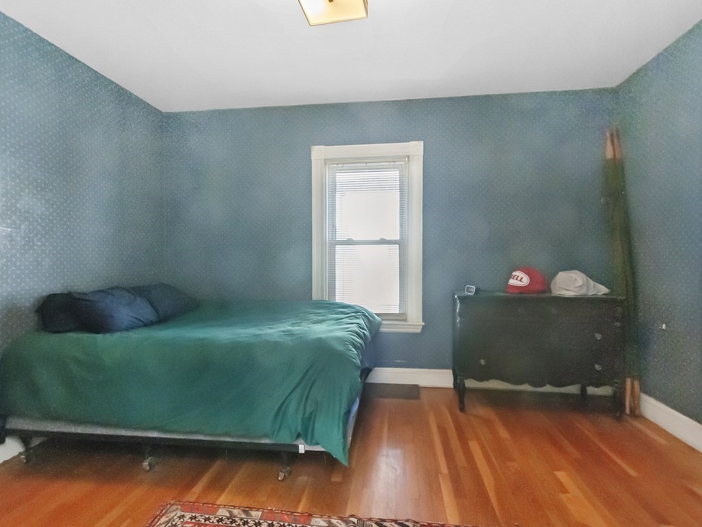 29 Garfield Avenue Boston, MA 02136 - Photo 18 of 27 a bedroom with a bed and a window