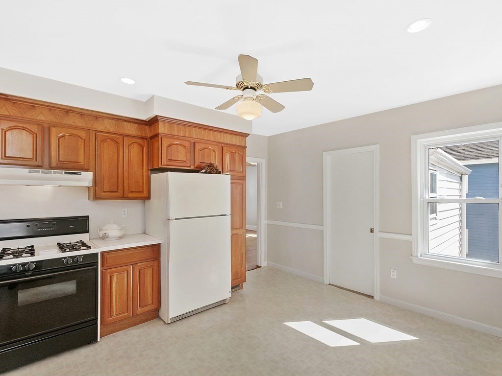 29 Garfield Avenue Boston, MA 02136 - Photo 3 of 27 a kitchen with stainless steel appliances granite countertop a refrigerator a stove a sink and dishwasher