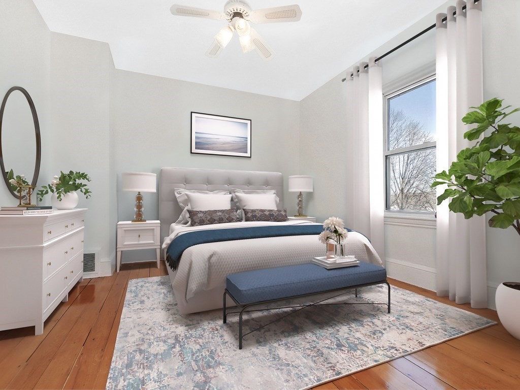 29 Garfield Avenue Boston, MA 02136 - Photo 6 of 27 a bedroom with a bed potted plant on the dresser and a window