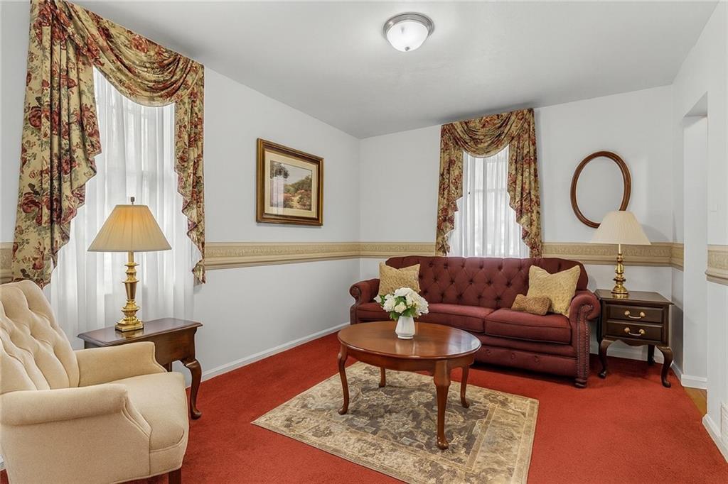 83 Gibson Street Pittsburgh, PA 15202 - Photo 15 of 27 a living room with furniture and a lamp