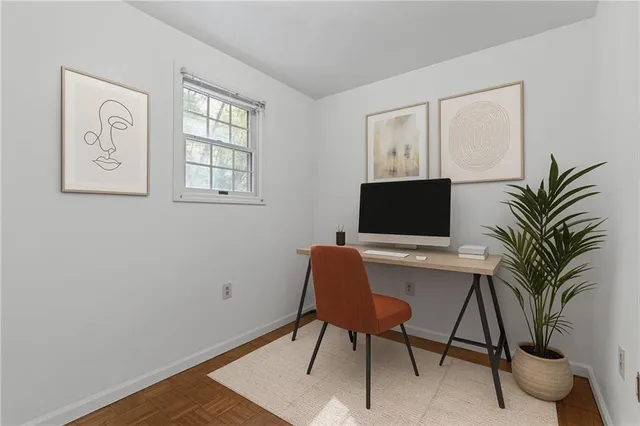 a workspace with furniture and window