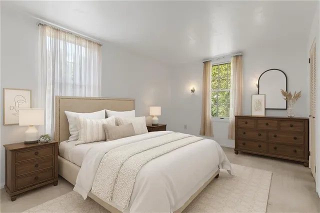 a bedroom with a bed and a dresser