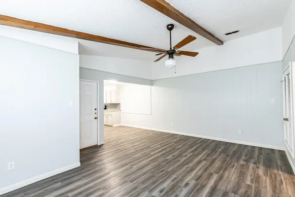 a view of an empty room with a window
