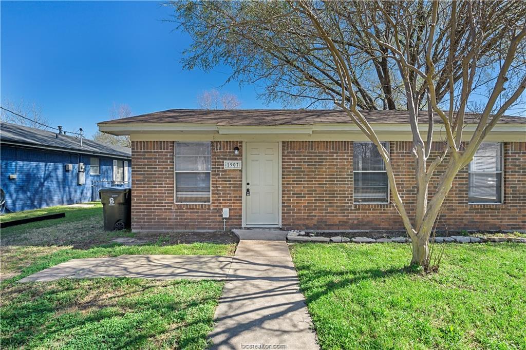 1907 Orman Street Bryan, TX 77801 - Photo 2 of 20 a front view of a house with a yard