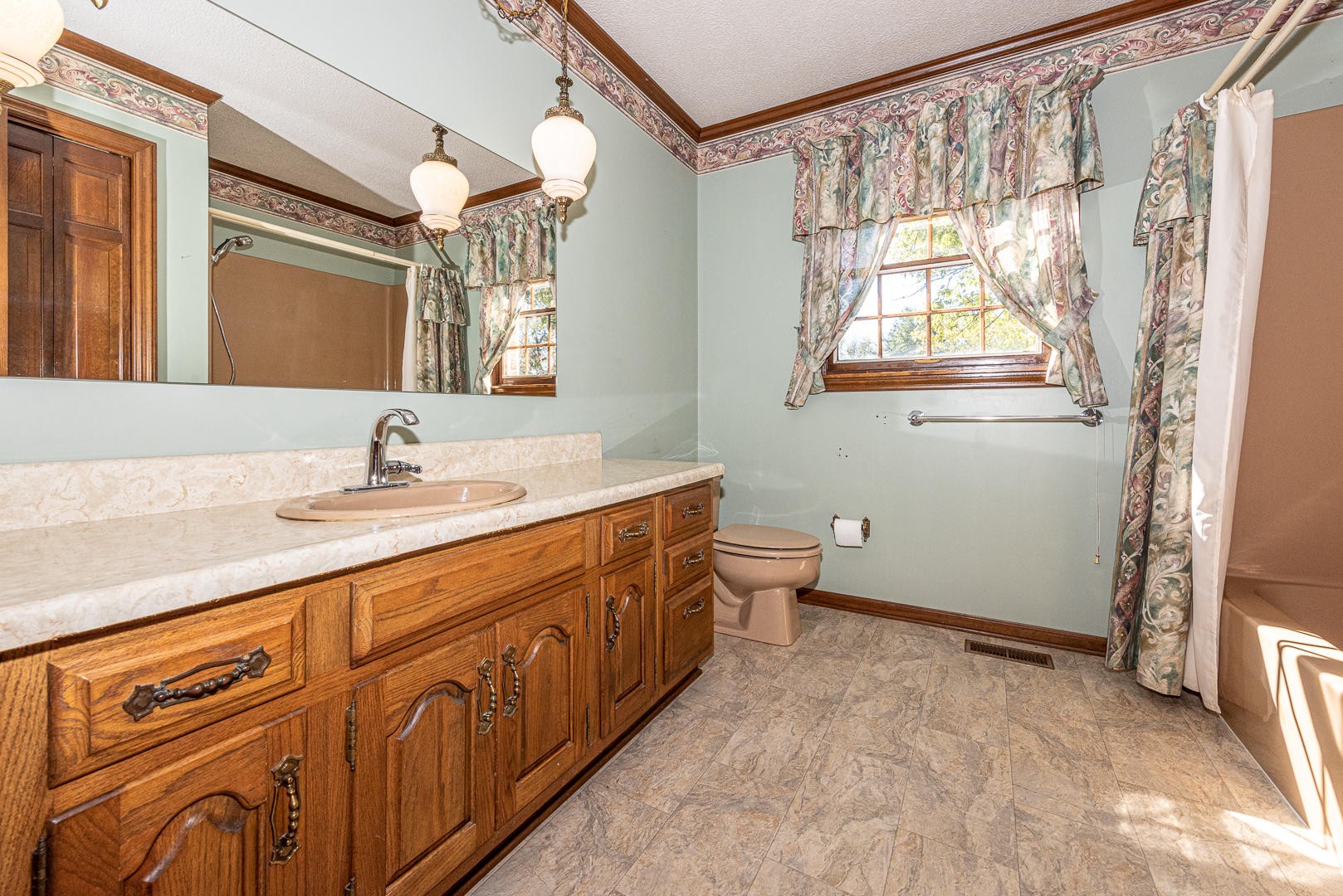 4333 Morganton Road Maryville, TN 37801 - Photo 17 of 40 a spacious bathroom with a double vanity sink a toilet and a mirror