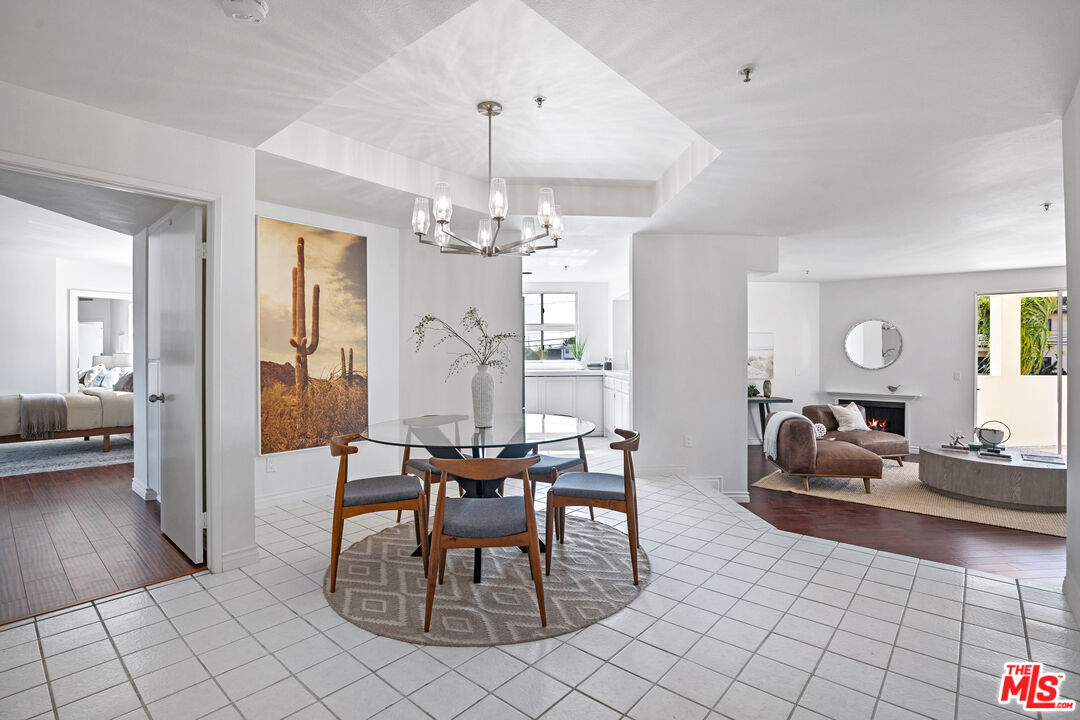 255 Main Street, Unit 101 Venice, CA 90291 - Photo 1 of 28 a living room with furniture and a chandelier