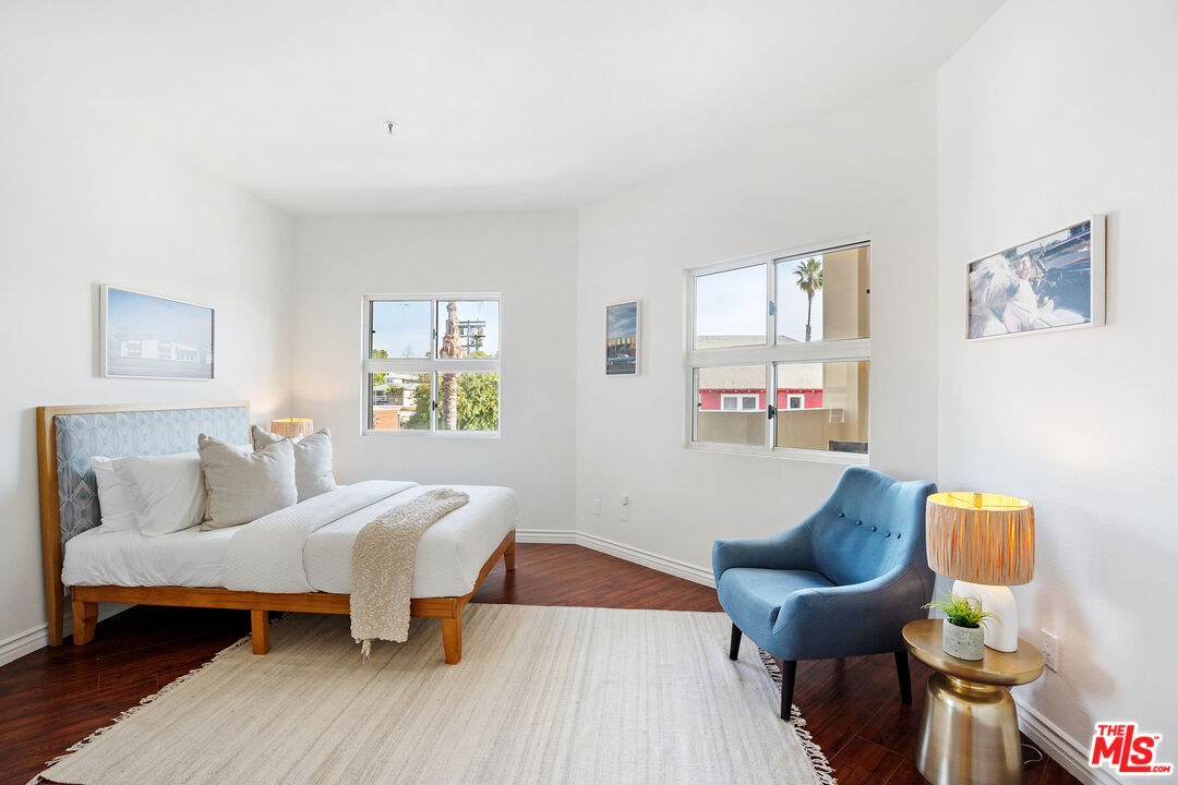 255 Main Street, Unit 101 Venice, CA 90291 - Photo 12 of 28 a bedroom with furniture and a wooden floor