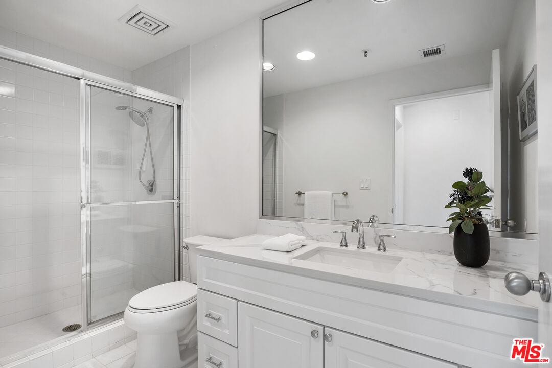 255 Main Street, Unit 101 Venice, CA 90291 - Photo 15 of 28 a bathroom with a sink a toilet and shower