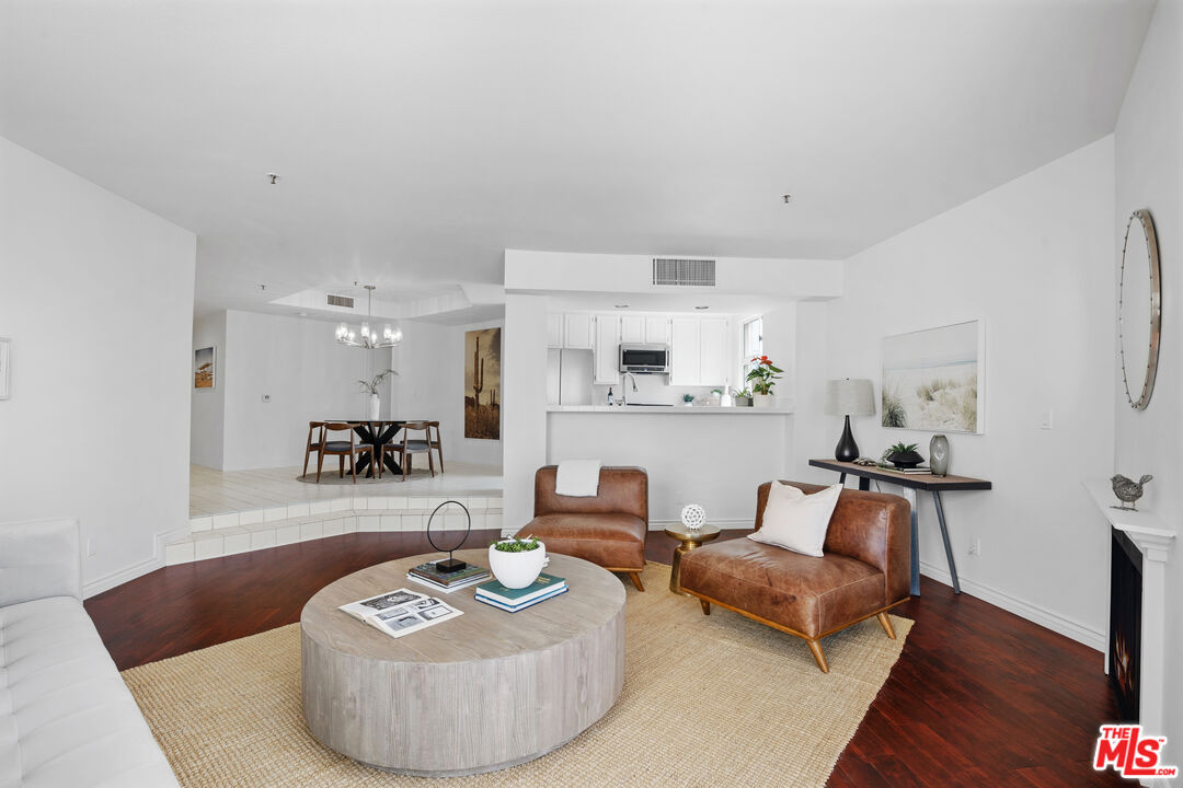 255 Main Street, Unit 101 Venice, CA 90291 - Photo 4 of 28 a living room with furniture and a wooden floor