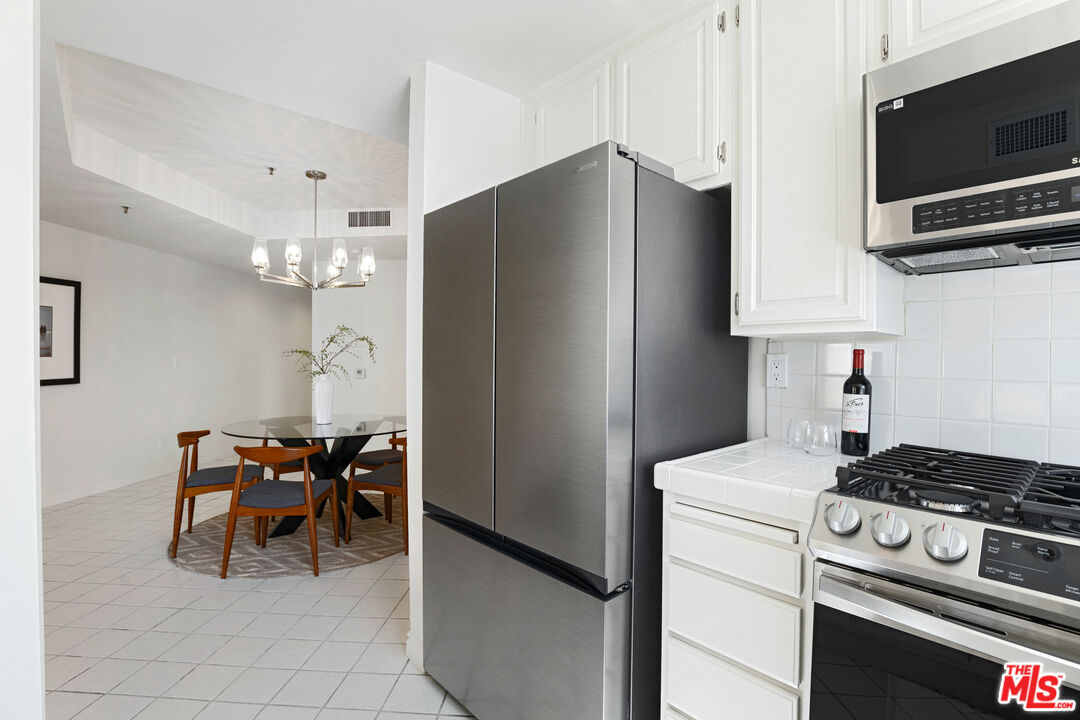 255 Main Street, Unit 101 Venice, CA 90291 - Photo 7 of 28 a kitchen with stainless steel appliances a refrigerator and a stove top oven