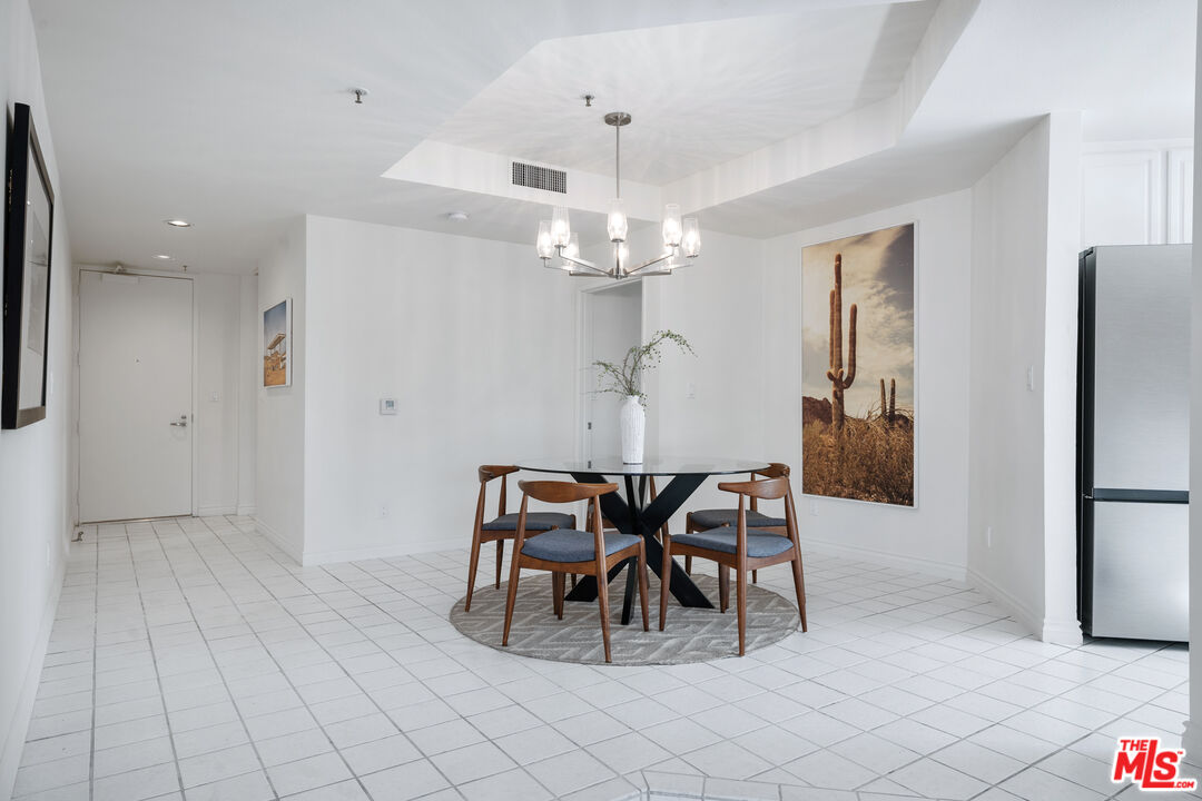 255 Main Street, Unit 101 Venice, CA 90291 - Photo 8 of 28 a view of a dining room with furniture and chandelier