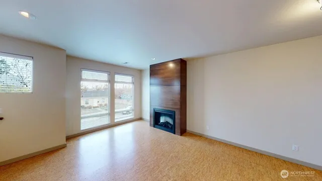 wooden floor in an empty room with a fireplace