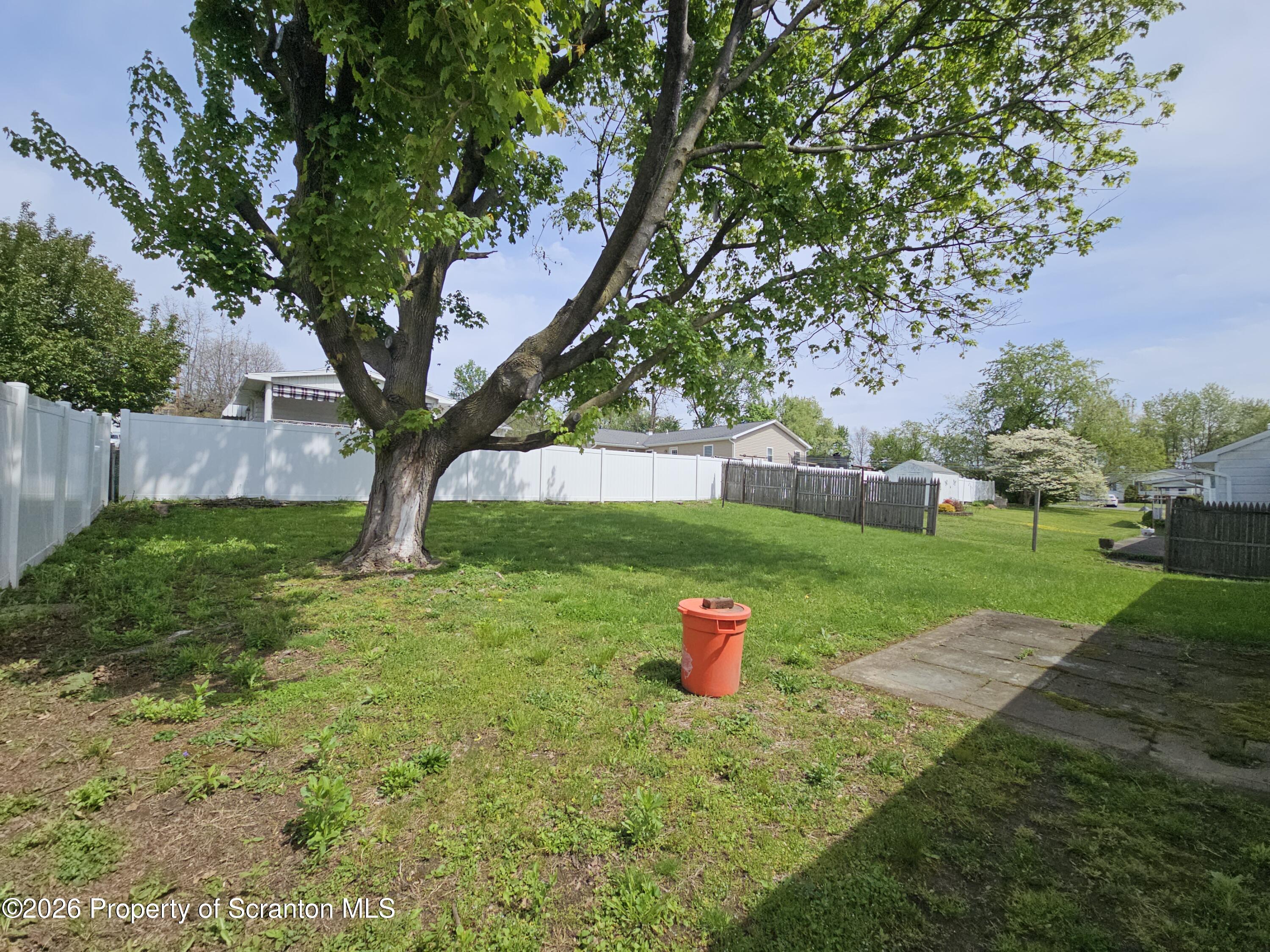 405 Baker Street Taylor, PA 18517 - Photo 5 of 36 a view of a backyard with a small cabin