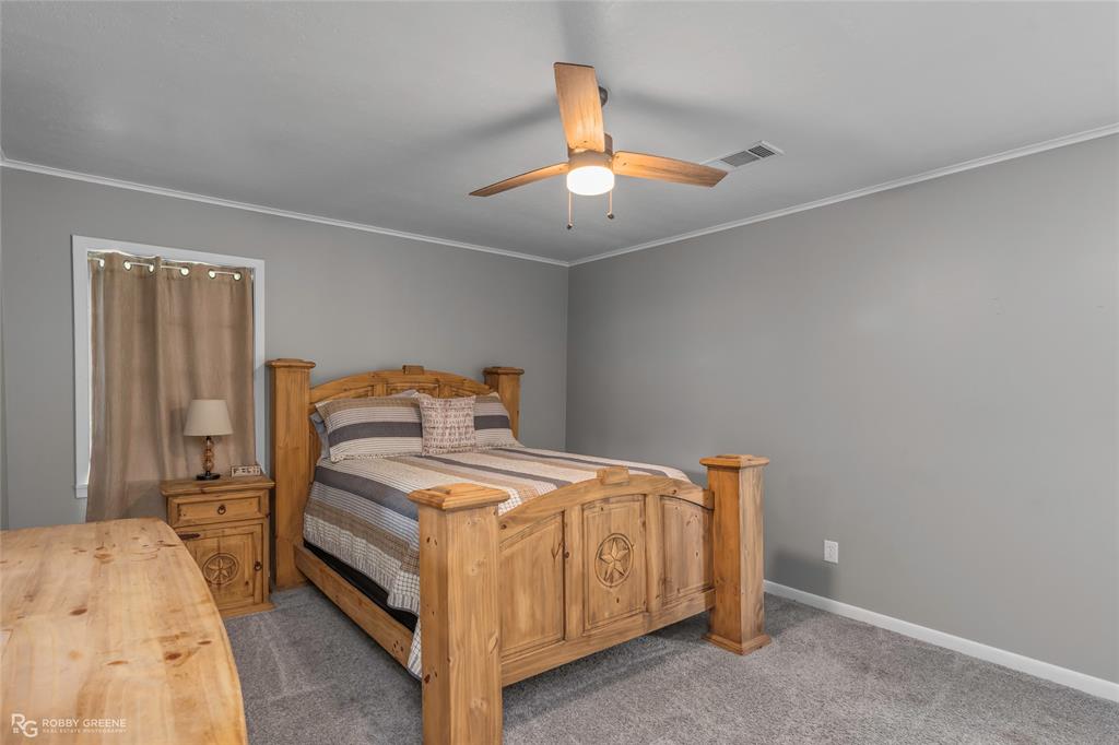 1426 Caney Lake Road Minden, LA 71055 - Photo 13 of 36 Spacious room featuring neutral gray walls, light gray carpet, and white trim