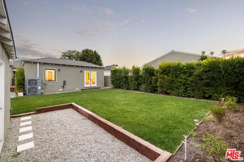 a view of backyard with green space