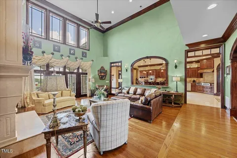 a room with furniture pool table and flat screen tv