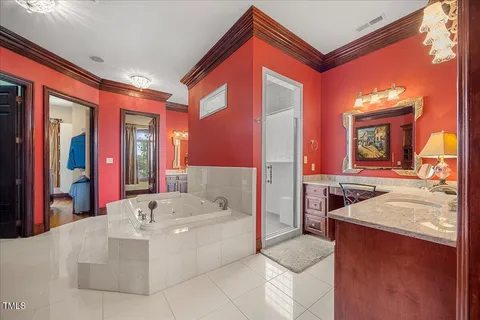 a bed room with a bed and a chandelier