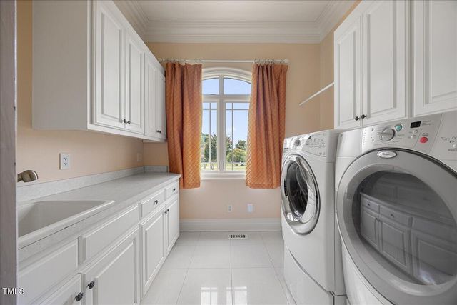 a view of a patio with a table and chairs