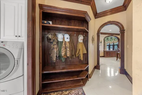 a view of a wooden deck with a table and chairs a barbeque with wooden floor and roof
