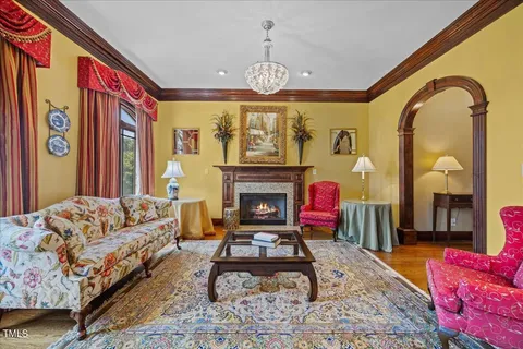 a view of a dining room with furniture wooden floor and chandelier