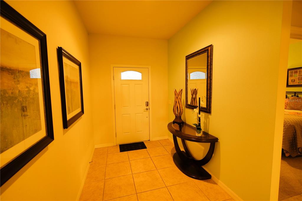 8809 Rhodes Street Kissimmee, FL 34747 - Photo 24 of 49 a bathroom with a sink and mirror