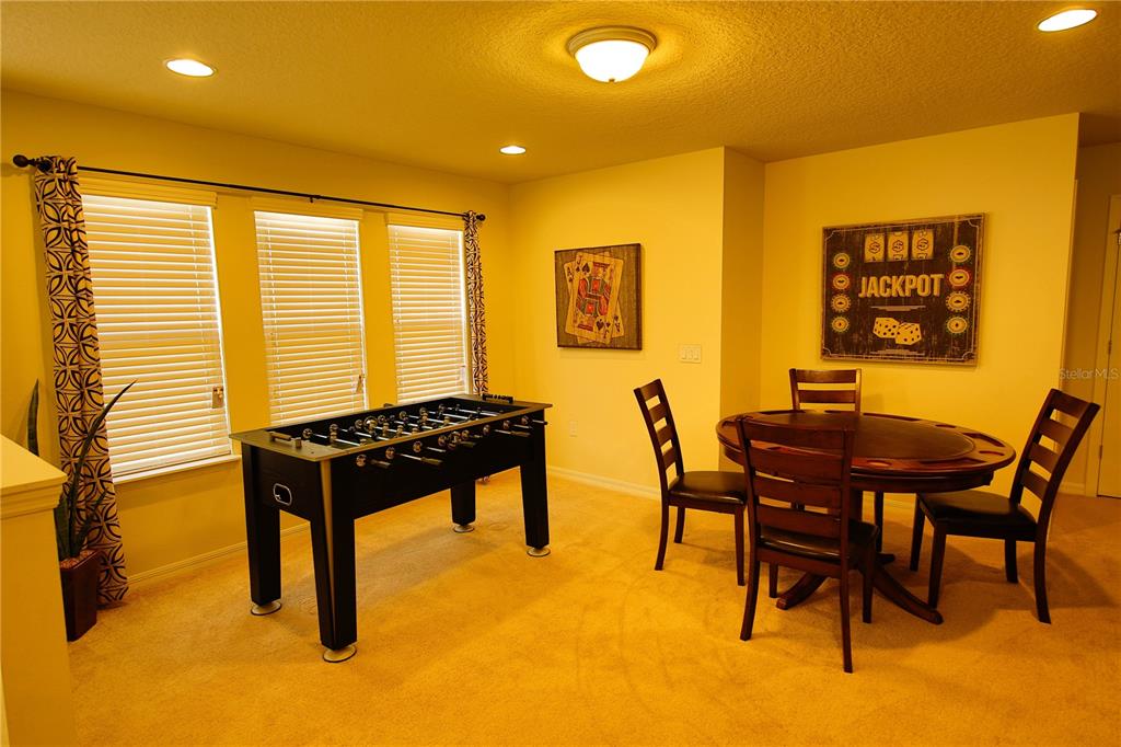 8809 Rhodes Street Kissimmee, FL 34747 - Photo 26 of 49 a view of a dining room with furniture and a window